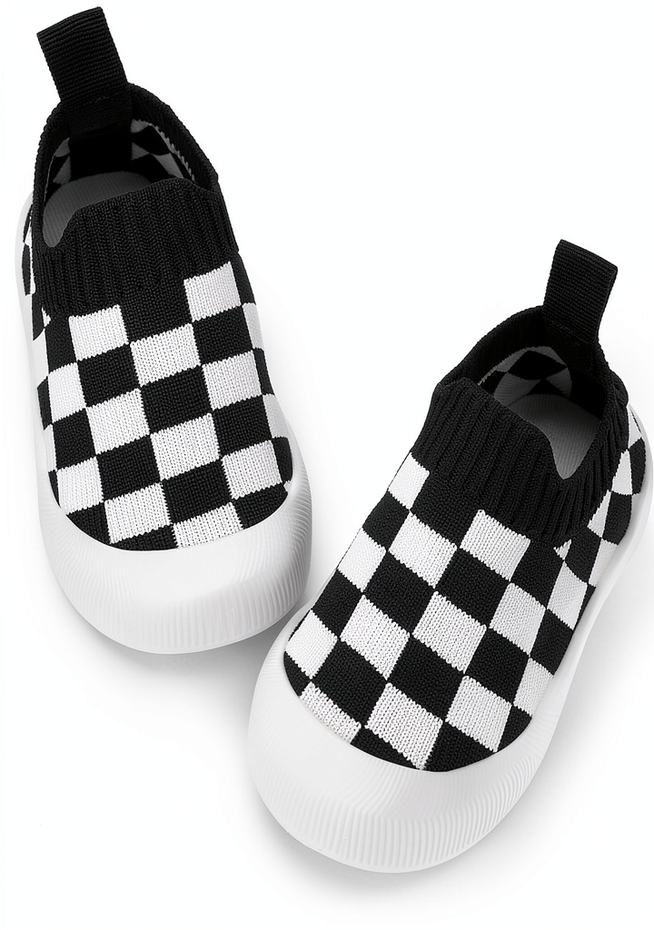 Baby wearing KidStep non slip sneakers playing on a carpet